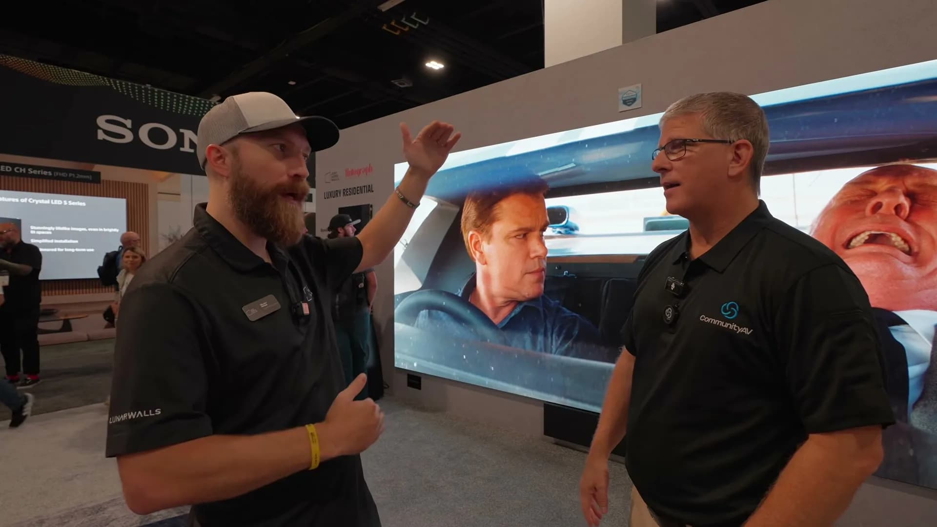 Skyler demoing a Just Video Walls MicroLED canvas on the CEDIA show floor