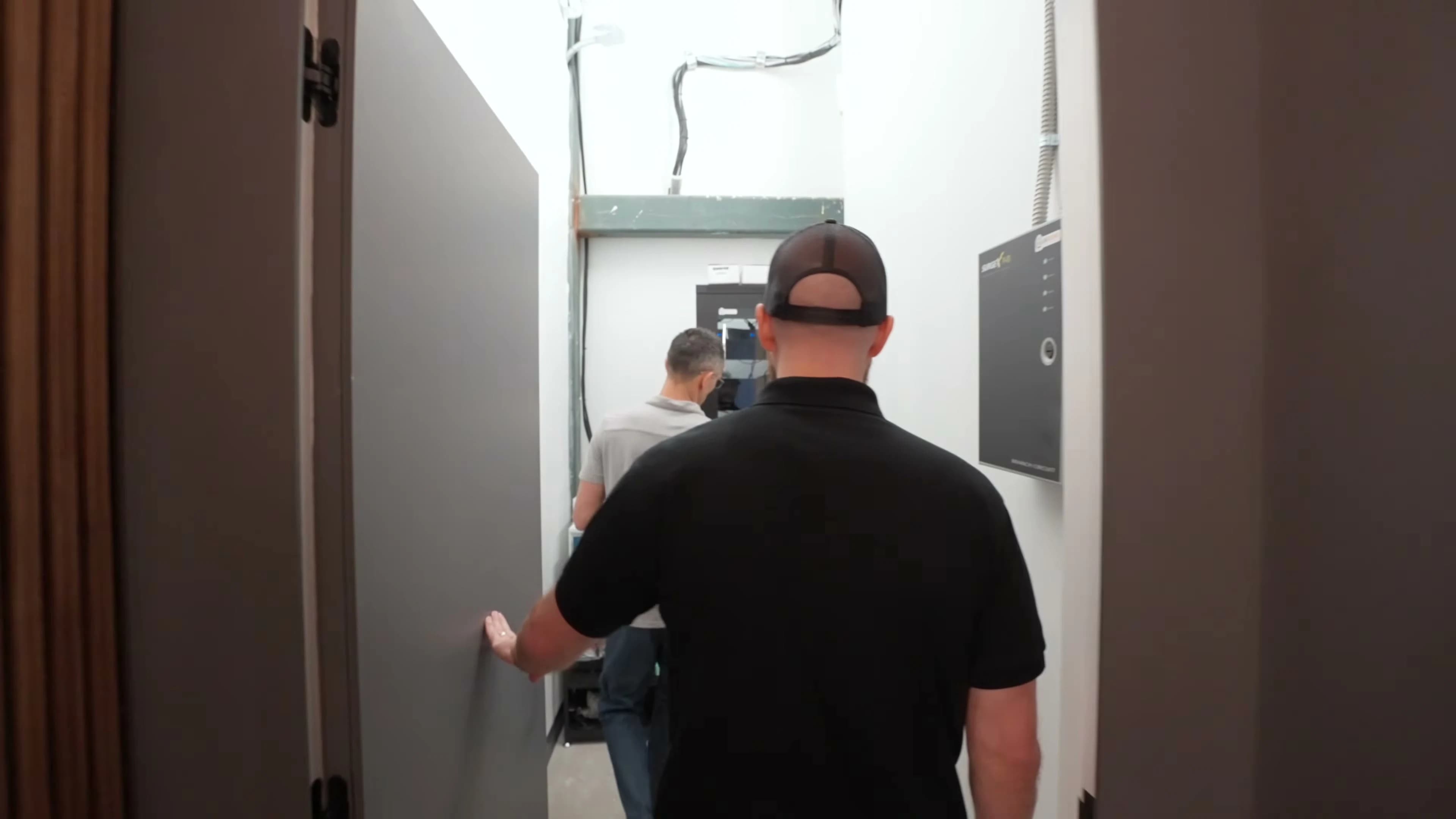 Golf simulator bays adjacent to the clubhouse display
