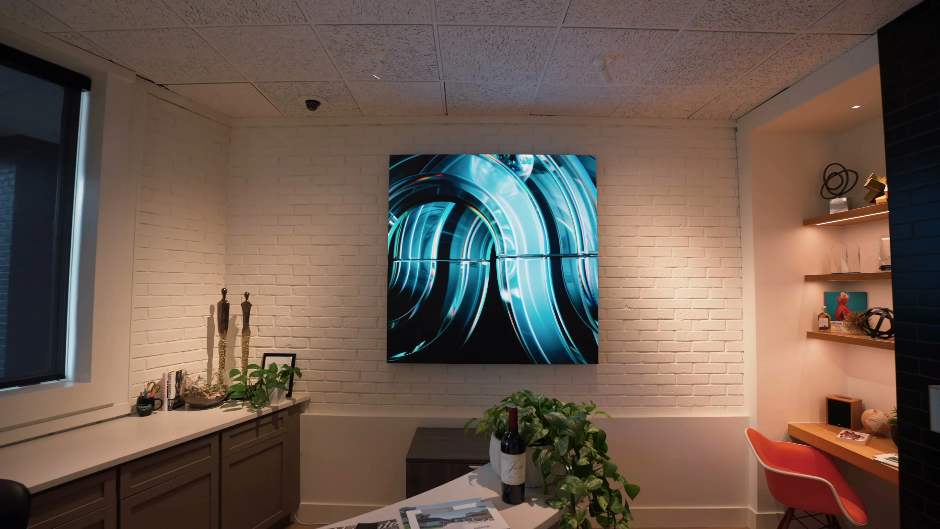 Square digital-art MicroLED and kitchen vignette at Premier Group Carmel