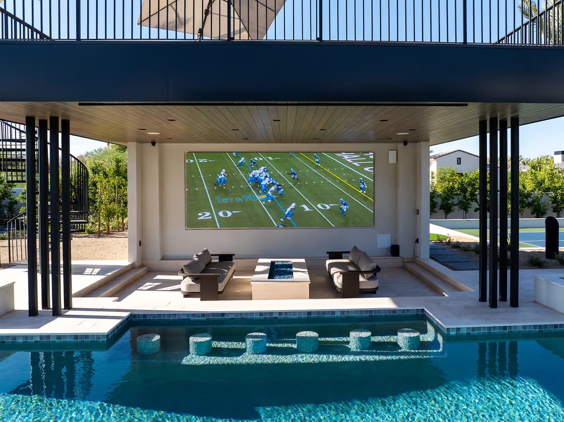 An outdoor lounge with a MicroLED wall