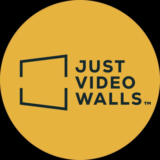Just Video Walls wordmark next to an open rectangular frame on a mustard yellow circle background.