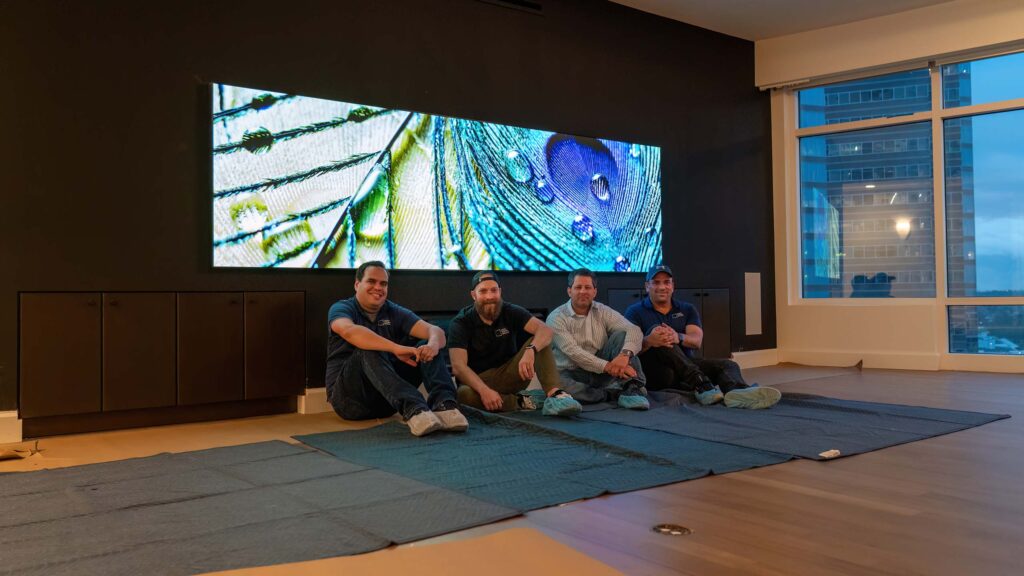 the team sitting in front of a microled installation