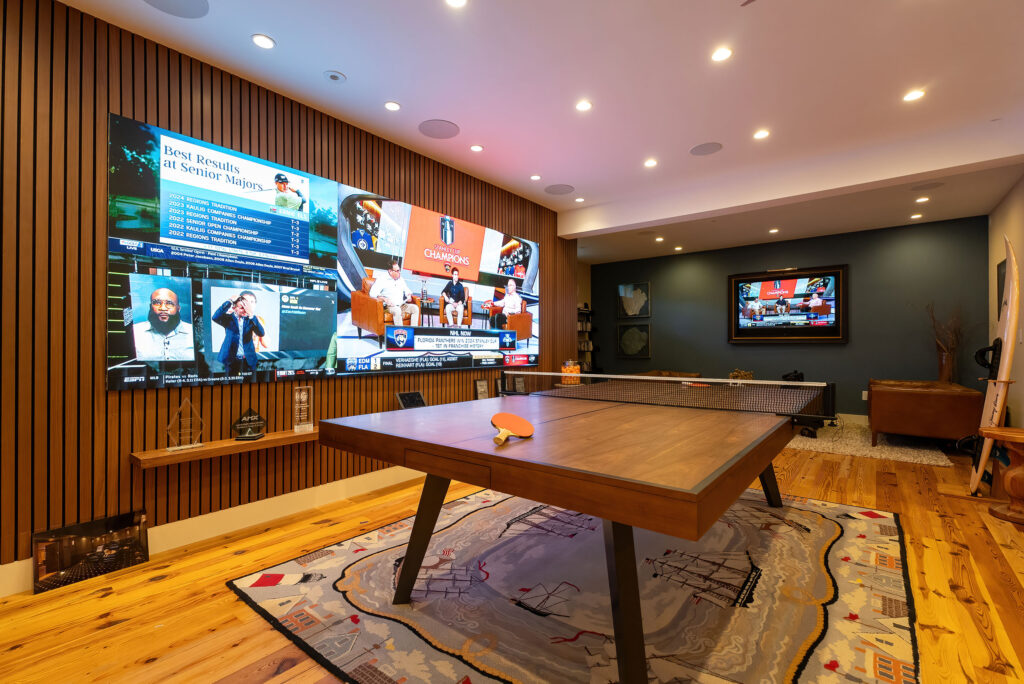 big video wall in front of ping pong table